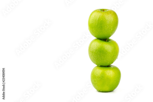 Macro shot of Fresh green apple with water drop isolated on white background.
