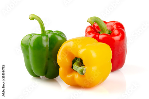 Three different colored of sweet bell peppers (capsicum) isolated on white background..