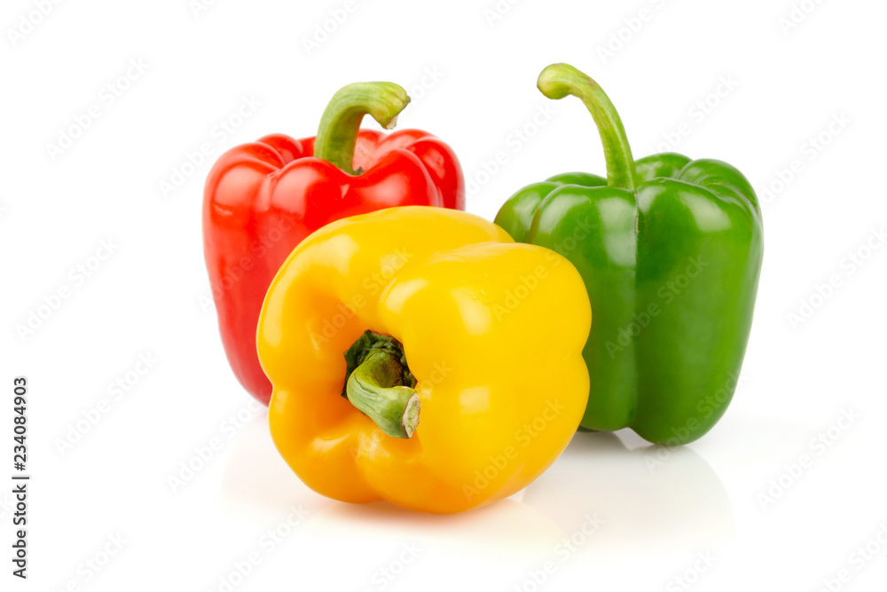 Three different colored of sweet bell peppers (capsicum) isolated on white background.