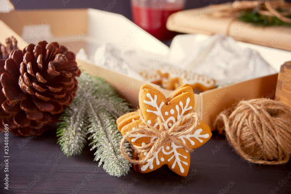 Christmas cookies snowflakes and gifts box on the wooden table Christmas cookies snowflakes and gifts box on the wooden table