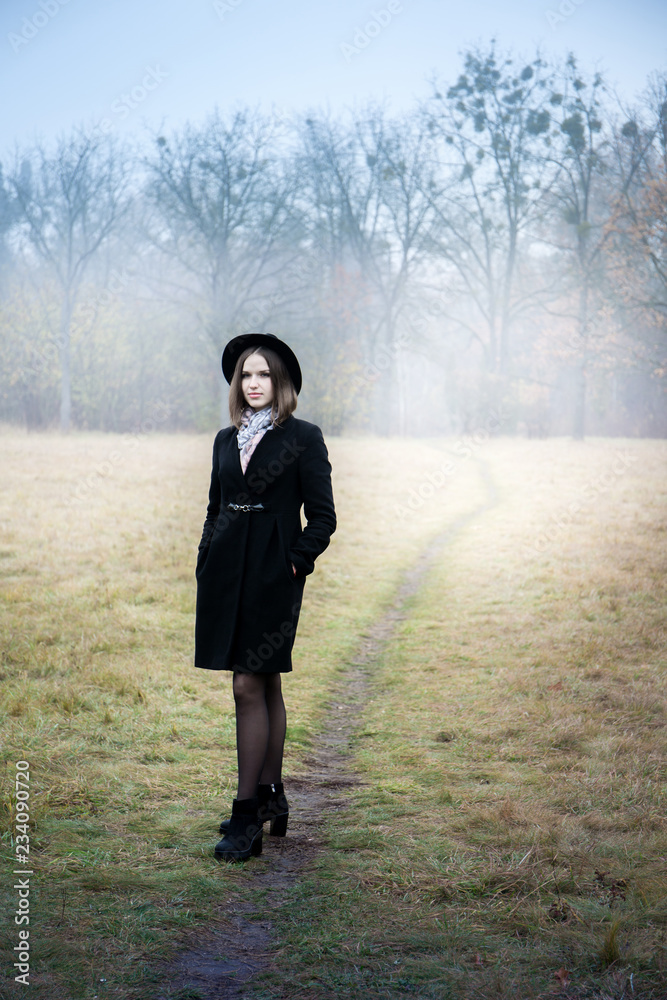 Sad girl in a short coat