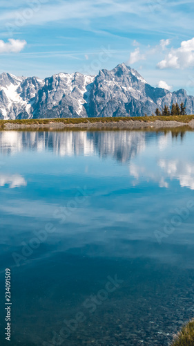 Fototapeta Naklejka Na Ścianę i Meble -  Smartphone HD wallpaper of  Beautiful alpine view at Leogang - Tyrol - Austria with reflections