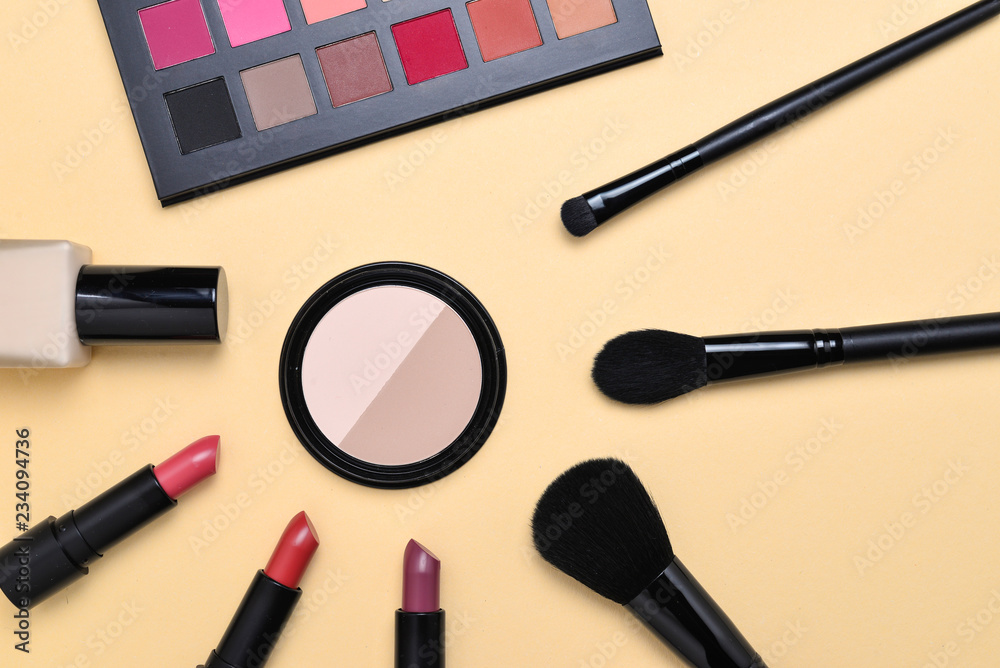 Professional makeup products with cosmetic beauty products, foundation, lipstick,  eye shadows, eye lashes, brushes and tools.