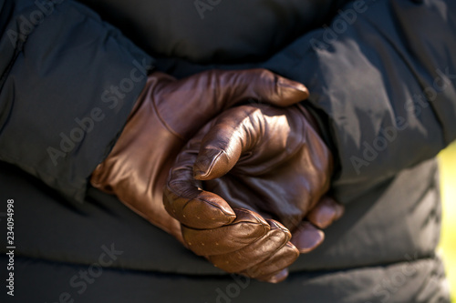 hands in brown gloves