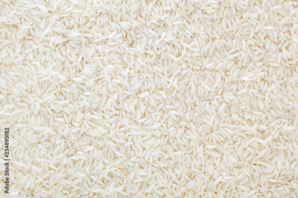 Uncooked white long-grain rice background