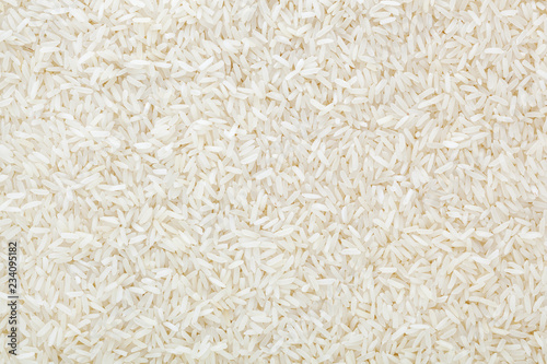Uncooked white long-grain rice background