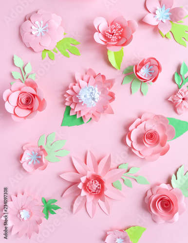 pink paper flowers on the pink background © EkaterinaVladimirova
