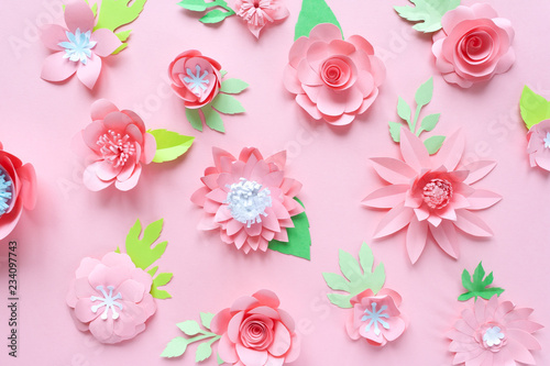 pink paper flowers on the pink background © EkaterinaVladimirova