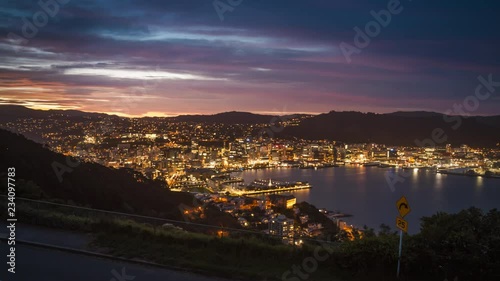 Timelapse of nightfall in Wellington, New Zealand. Beautiful view of the cityscape as it is getting dark. photo