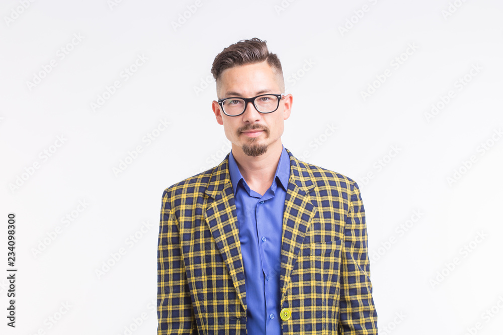 Handsome man in jacket with beard and mustache in glasses standing over white background Handsome man in jacket with beard and mustache in glasses standing over white background