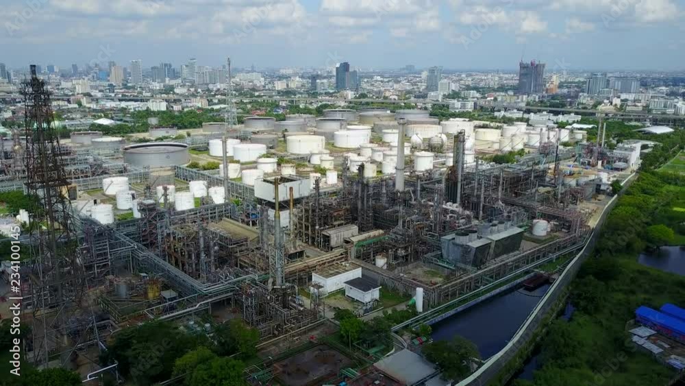 4K. Aerial view of oil and gas refinery or petroleum refinery. Plant factory of petrochemical industry and chemical manufacturing. Fuel and power resources. Shot from drone. 4K. Aerial view of oil and gas refinery or petroleum refinery. Plant factory of petrochemical industry and chemical manufacturing. Fuel and power resources. Shot from drone.