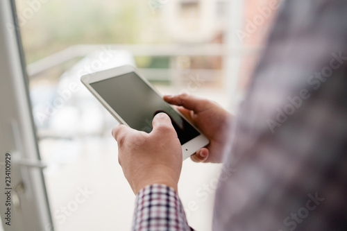 man using digital tablet