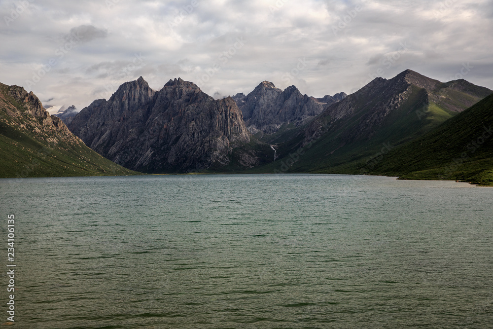 Nianbaoyuze - Holy Mountain in Jiuzhi County. Located in the Grassland of Guoluo Plain, Qinghai Province, China. High Altitude Goddess Lake, Mountains and flowers. Holy Tibetan Lake, Hiking Trekking