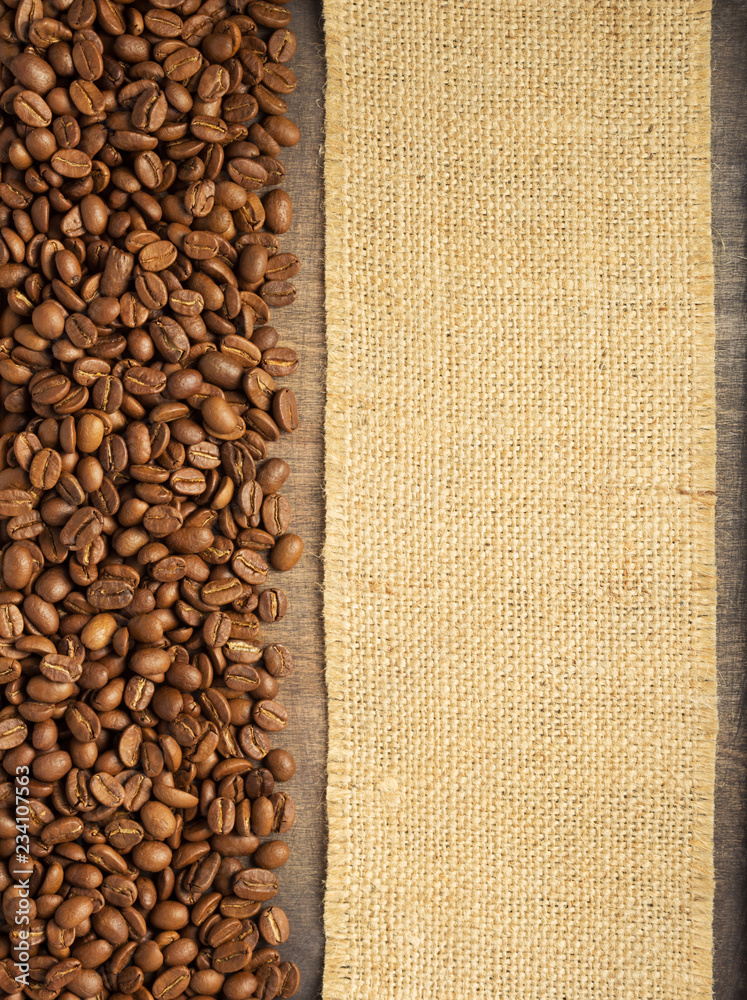 Fototapeta premium coffee beans on wooden table