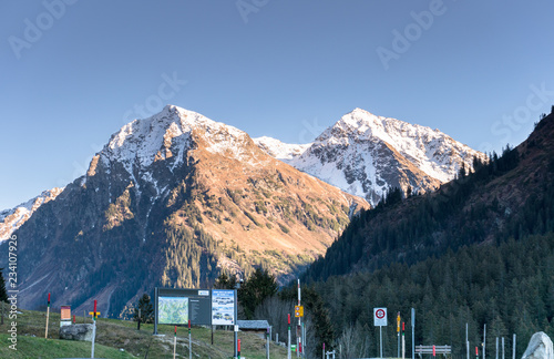 Monbiel, GR / Switzerland - November 18, 2018: idyllic mountain landscape defaced by numerous street signs and billboards and warning signs