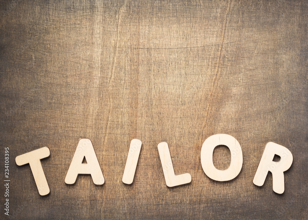Fototapeta premium tailor letters on wooden table