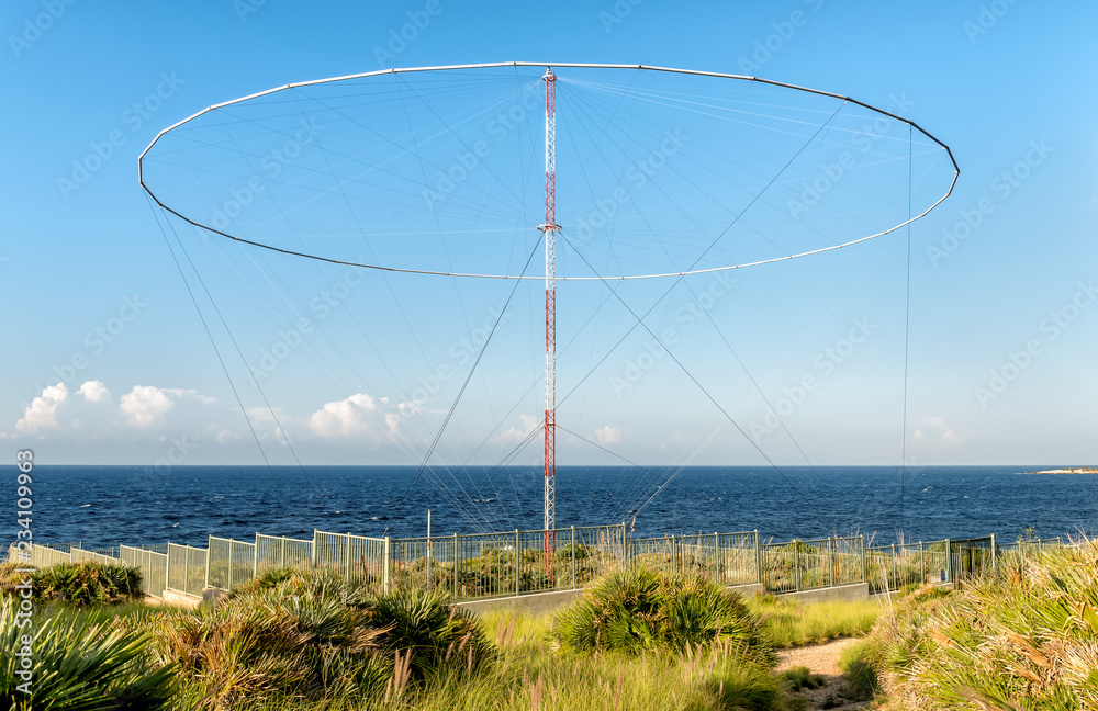 Electric communication beacon, located on the shore of Mediterranean sea in Sicily.