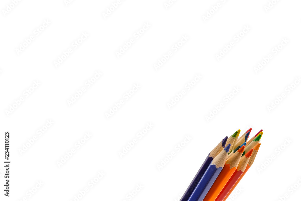 Fototapeta premium Colored pencils arranged in a group isolated on white background