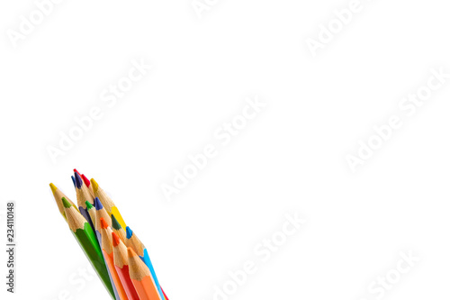 Colored pencils arranged in a group isolated on white background