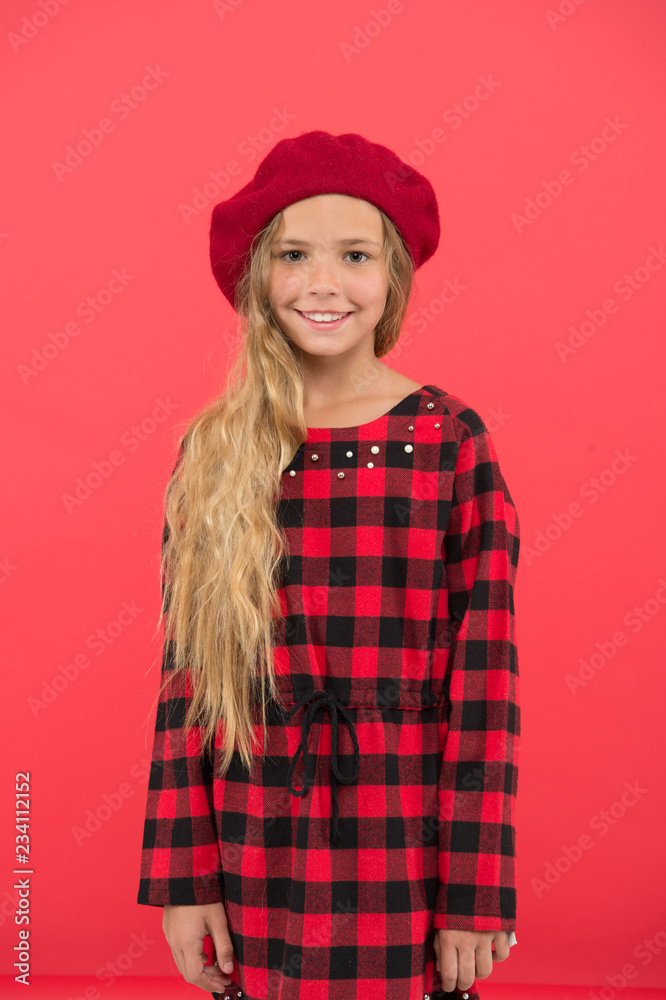 Kid little cute girl with long hair posing in hat red background. Fashionable beret accessory for female. How to wear french beret. Beret style inspiration. How to wear beret like fashion girl Kid little cute girl with long hair posing in hat red background. Fashionable beret accessory for female. How to wear french beret. Beret style inspiration. How to wear beret like fashion girl