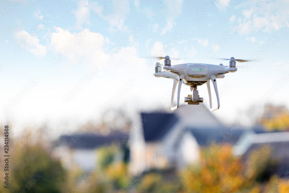 drone flying front of home - obrazy, fototapety, plakaty 