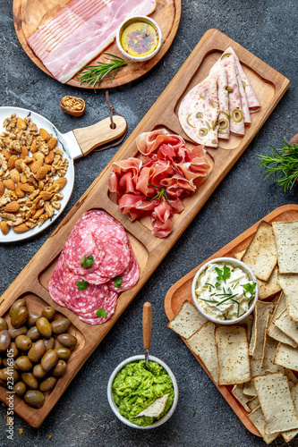 Antipasto Platter. Ham serrano, salami olive jamon dip sauces and red wine