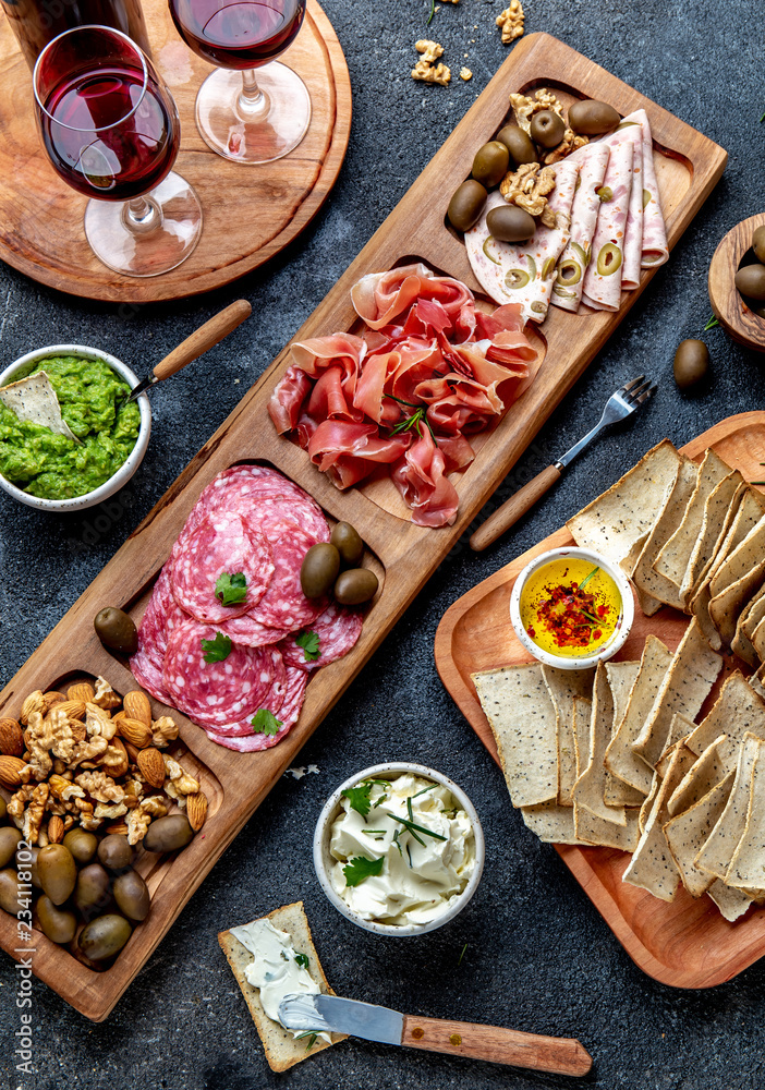 Antipasto Platter. Ham serrano, salami olive jamon dip sauces and red wine Antipasto Platter. Ham serrano, salami olive jamon dip sauces and red wine