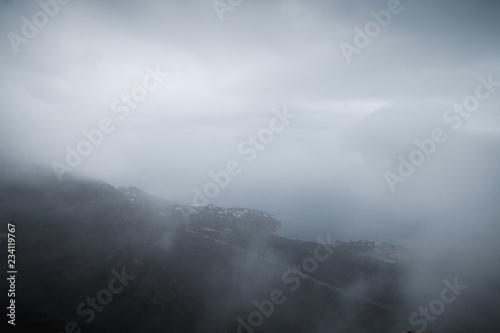 Dark mountain landscape with fog