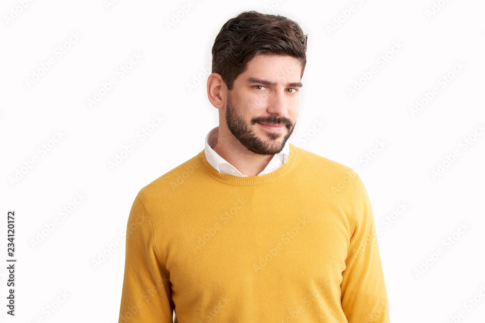 Young businessman wearing casual clothes while standing at isolated white background Young businessman wearing casual clothes while standing at isolated white background