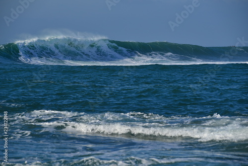 Ocean wave, Jersey, U.K. Telephoto image of the ocean in Autumn. © alagz