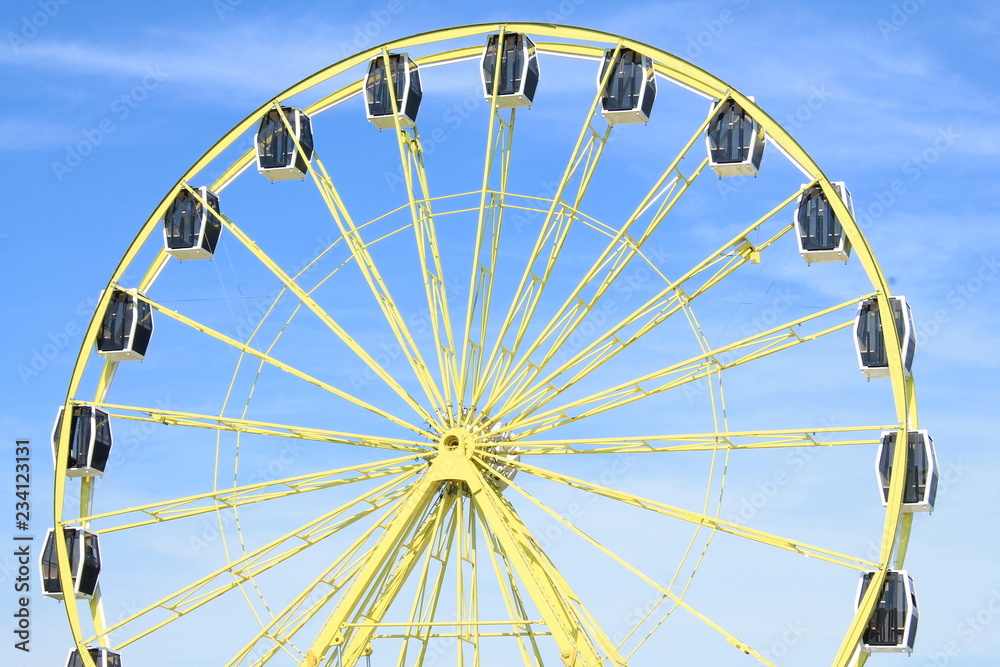 Blue sky and colorful big wheel 