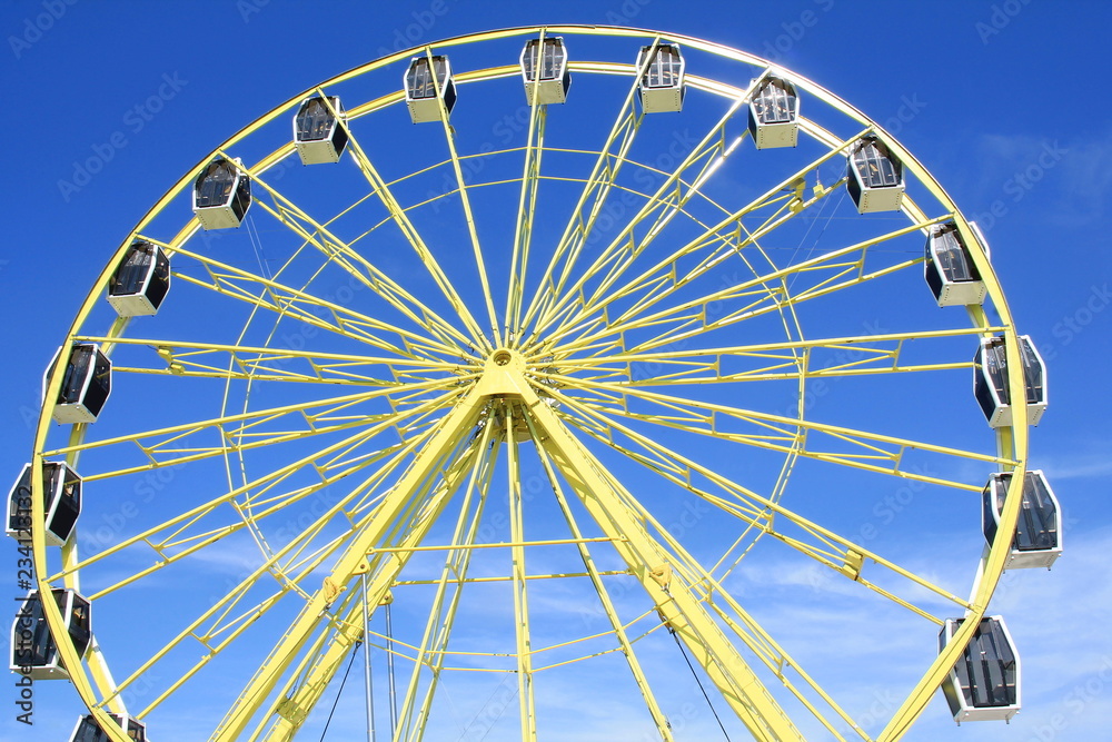 Blue sky and colorful big wheel 