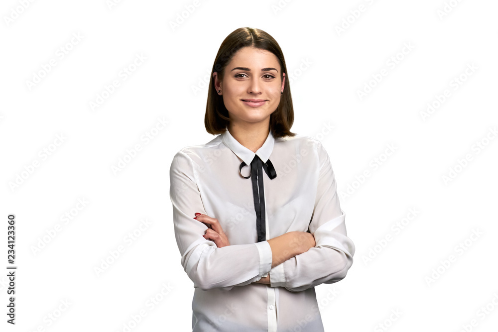 Portrait of businesswoman on white background. Young friendly woman standing with arms crossed isolated on white bacground. Portrait of businesswoman on white background. Young friendly woman standing with arms crossed isolated on white bacground.