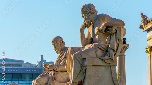 Zoom out of the statues of the Greek philosophers Socrates & Plato