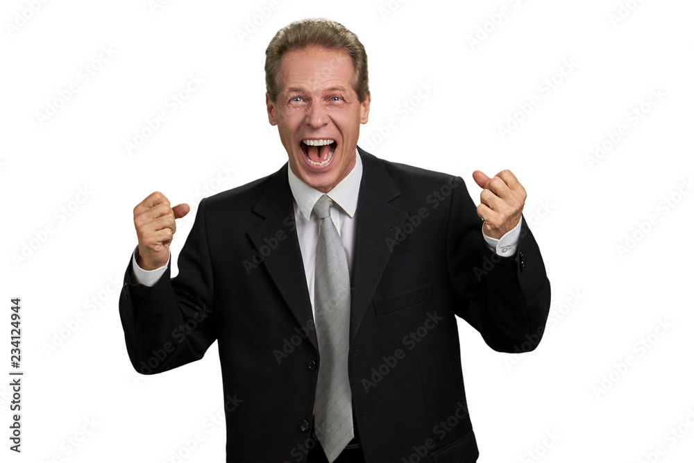 Ecstatic male executive with raised fists. Portrait of excited man in formal wear clenching fists over white background. Business triumph concept. Ecstatic male executive with raised fists. Portrait of excited man in formal wear clenching fists over white background. Business triumph concept.