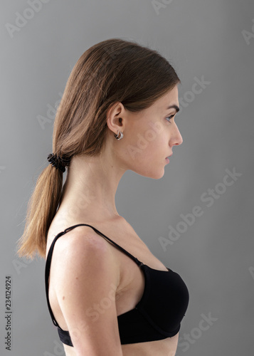 Standard model tests of young pretty woman on a gray background,Test Shots young models for modeling agency on a gray background with ,young beautiful woman in underwear. portrait of slim woman