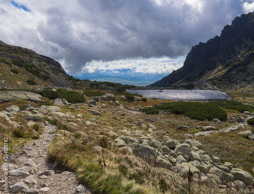 Pleso nad Skokom, beautiful mountain lake in Mlynicka Dolina Valley with footpath trail in High Tatras mountain, Vysoke Tatry , Slovakia photo