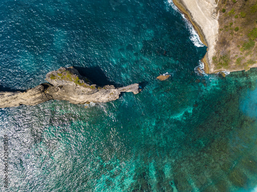 Aerial top view to ocean cliff and turquoise water. Nusa Penida island, Indonesia