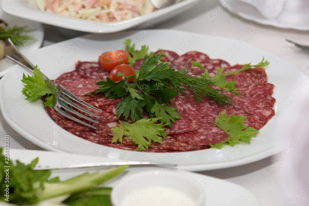 Cold dishes and snacks on the festive table. A rich luxurious meal in the restaurant. Cold dishes and snacks on the festive table. A rich luxurious meal in the restaurant.