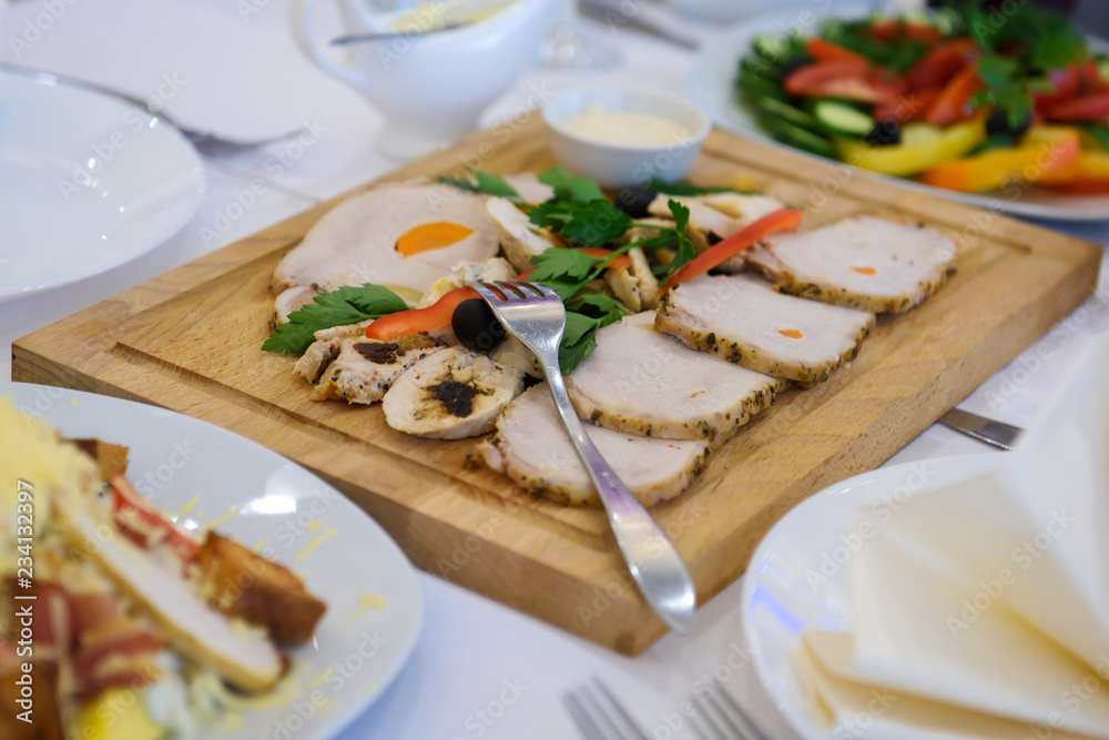 Cold dishes and snacks on the festive table. A rich luxurious meal in the restaurant. Cold dishes and snacks on the festive table. A rich luxurious meal in the restaurant.