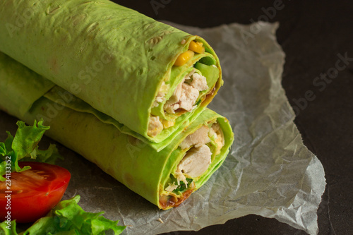 burrito green spinach wraps with meat and vegetables  (tortilla wraps). top view. copy space