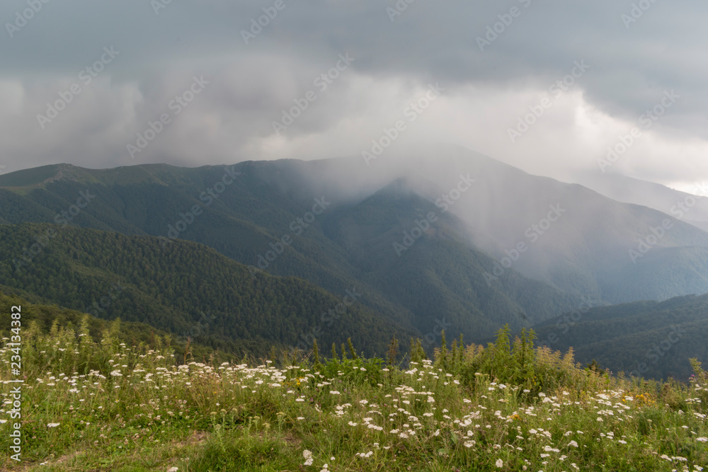 Beautiful mountain view with upcoming storm from the hills on the path to the Eho hut. The Troyan Balkan is exceptionally picturesque and offers a combination of wonderful mountain scenery, fresh air.