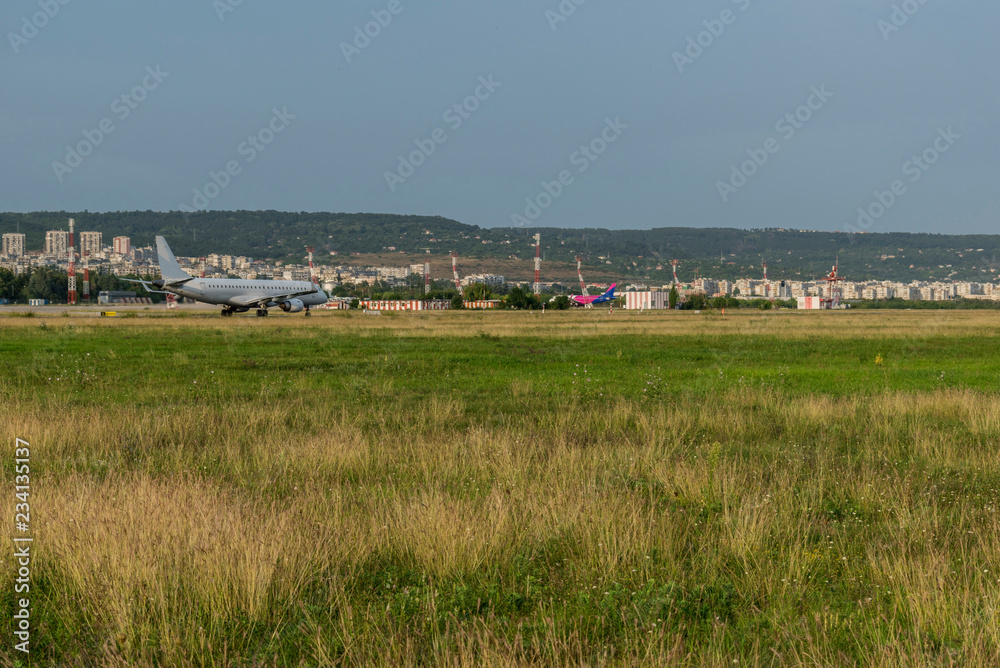 Arriving plane at the airport in Varna in the middle of the tourist season. Arriving plane at the airport in Varna in the middle of the tourist season.