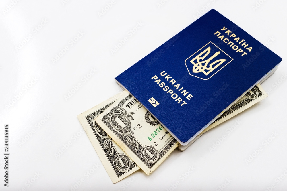 Ukrainian passport on a world map on a white background, background and texture. Ukrainian passport on a world map on a white background, background and texture.