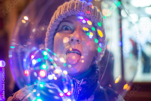 Woman with a glowing balloon