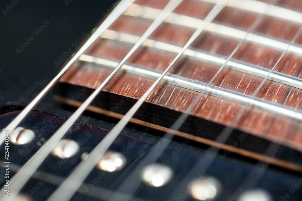 guitar with wooden brown neck and strings, close up blurry background, texture, abstract guitar with wooden brown neck and strings, close up blurry background, texture, abstract