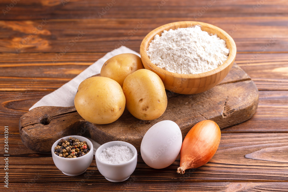 Ingredients for traditional potato pancakes or latke Hanukkah celebration Ingredients for traditional potato pancakes or latke Hanukkah celebration