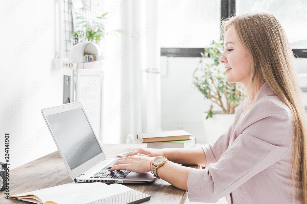 Young business woman working at home. Creative Scandinavian style workspace