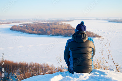   man on the top of the mountain, Travel and tourism in the winter, self-realization and achievement of the goal. Winter concept