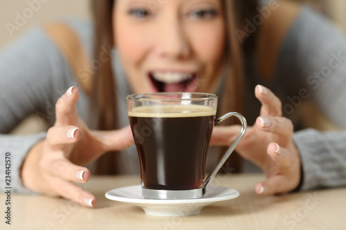 Konstfotografi Amazed woman looking at a coffee cup